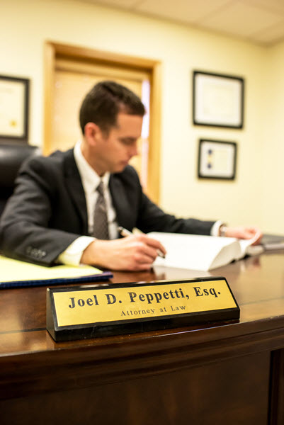 Photo of Joel D. Peppetti at His Desk